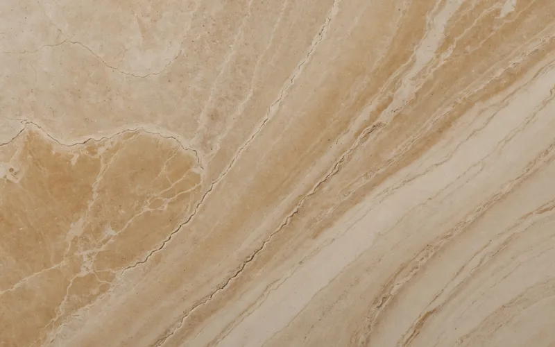 Designer and client compare full stone slabs at a stone yard, reviewing bookmatched panels against a residential project layout